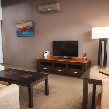 The Henry Jones Art Hotel Hobart Eksteriør billede A living room in a typical apartment at the Village at Grand Traverse Commons